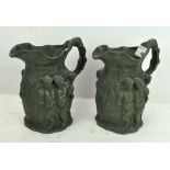 A pair of relief-moulded stoneware jugs,