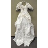 A cream polyester and silk wedding dress,