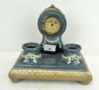 A German pottery clock case by Eichwell, early 20th century, glazed in blue,