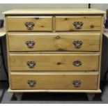 A pine chest of two short and three long drawers,