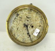 An early 20th century ship's wall clock of circular form,