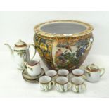 A Japanese tea service decorated with cranes and a fish bowl,