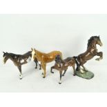 Three Beswick horses including a rearing stallion,