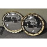 Two wall circular giltwood wall mirrors, one studded with balls, 20th century,