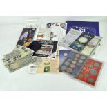 A collection of Commemorative coin sets and medals, including a 1953 Coronation coin,