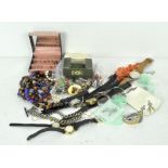 A collection of assorted costume jewellery including watches, brooches,