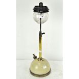 A vintage brass and painted tilly table lamp, with glass shade,