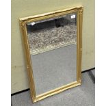 A gilt framed bevelled edged mirror of rectangular form,