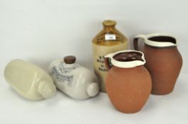 A group of stoneware jugs and jars, including a botanical brewers jar from W S Griffin & Son,