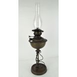 An early 20th century brass oil lamp by Veritas, with original glass funnel,