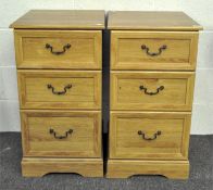 A pair of bedside cabinet chests of drawers, each with three drawers,