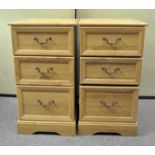 A pair of bedside cabinet chests of drawers, each with three drawers,