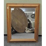 A modern pine framed mirror,