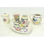 Five pieces of Poole pottery, to include milk jug,