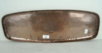 An Arts and Crafts hammered copper tray of oblong form, by Hugh Wallace,