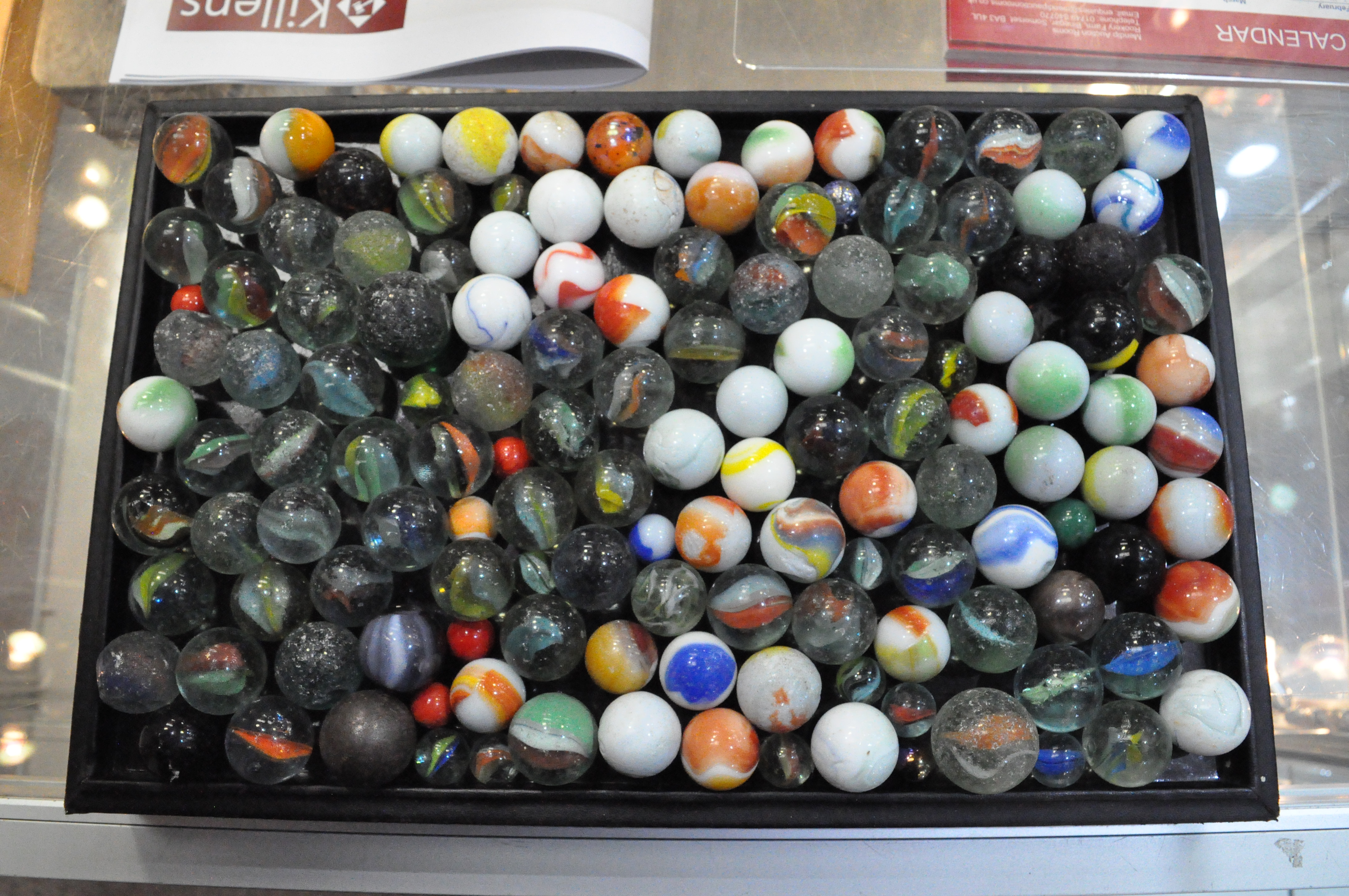 A large collection of glass marbles of varying size and design