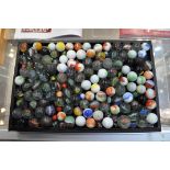 A large collection of glass marbles of varying size and design
