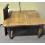 An oak extending dining table with leaf, early to mid 20th century,