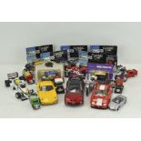 A collection of die cast vehicles, including boxed Classic car models,