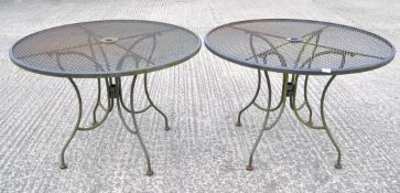 Two circular metal garden tables