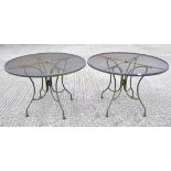 Two circular metal garden tables