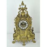 An ornate gilt brass quartz mantle clock,