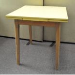 A mid-century yellow formica kitchen table (extendable) 75cm x 81cm x 76cm (closed)