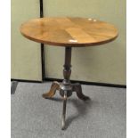 A mahogany tripod table of circular form,