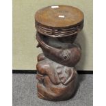 A carved wood elephant stool, 20th century, with circular top,