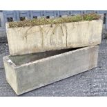 Two reconstituted stone rectangular plant pots, of fluted form,