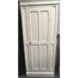 A Victorian white painted Railway Waiting room cupboard, with a four panelled door,