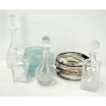 A group of glass decanters and bowls, including a thick walled bowl with brown incusions,