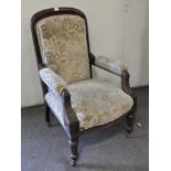 A 19th century upholstered armchair, with cushioned upholstered back, arm rests and seat,