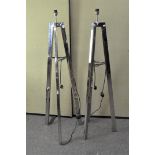 A pair of modern chrome standard lamps, of tapering tripod form,