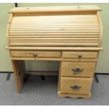 A modern pine tambour bureau,