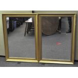 Two gilt framed wall mirrors of rectangular form,