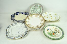 A collection of assorted ceramic plates, including pieces by Royal Crown Derby,