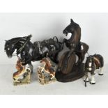 A group of horse figures, including two pottery models of shire horses with mounts,