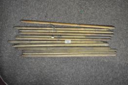 A set of brass stair rods,
