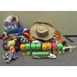 A collection of various toys, including soft "my football Monster" toy,