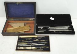 A late 19th/early 20th century boxed set of drawing instruments,