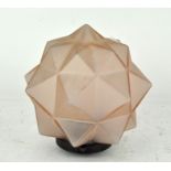 An Art Deco opaque rose tinted glass star shaped lamp shade, with fixture,