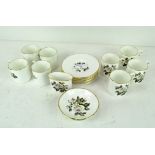 A Royal Worcester eight piece coffee set, comprising coffee cans, saucers,