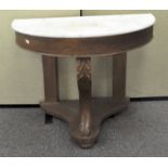 A marble topped washstand of demi-lune form,