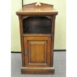 An early 20th century pot cupboard, single shelf over a single door cupboard,