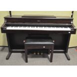 A Rowland digital piano, HP557R and adjustable stool in a mahogany effect finish, 144cm wide,