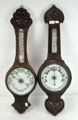 Two late 19th/early 20th century oak aneroid wall barometers,