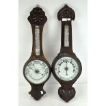 Two late 19th/early 20th century oak aneroid wall barometers,