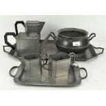 A collection of pewter including an art deco style three piece teaset