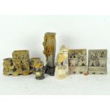 A collection of soapstone items, including a Chinese three part spill vase,